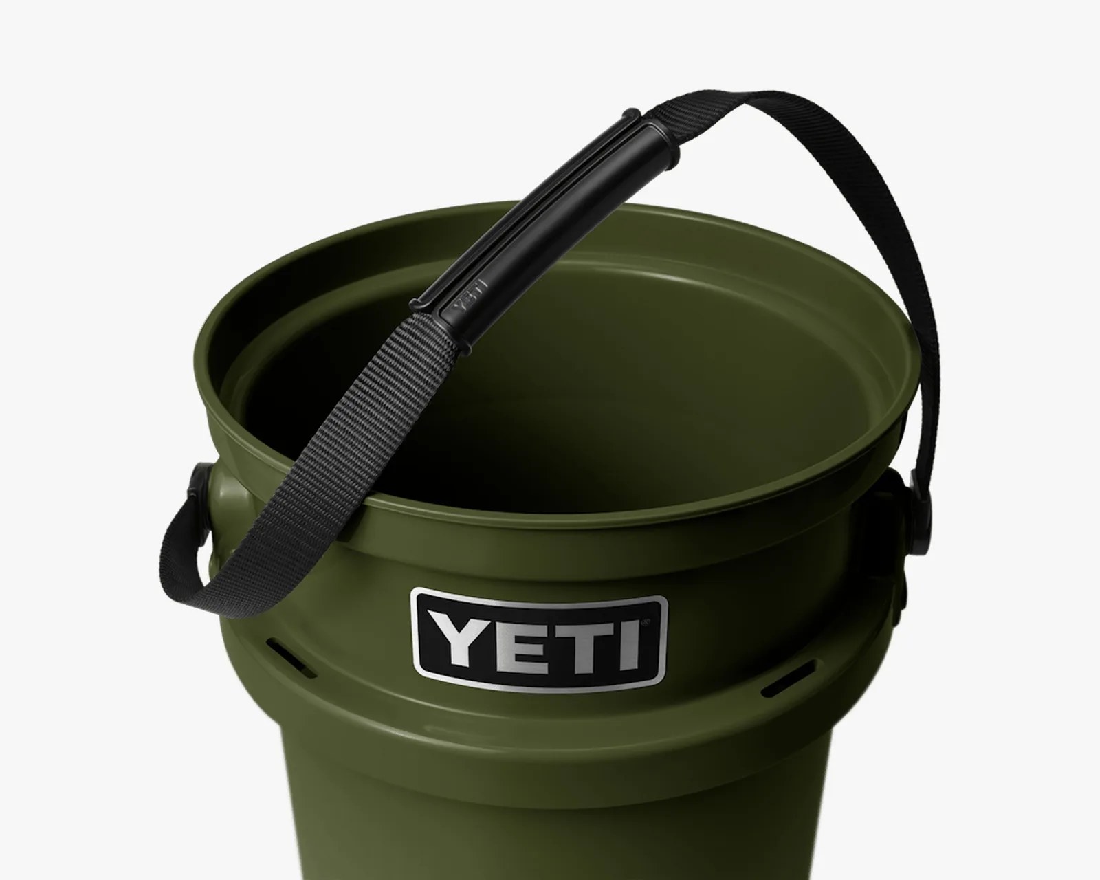 Olive green YETI bucket with black strap and handle grip.